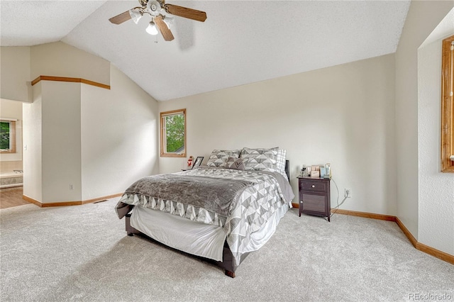 19149 E Ida Dr, Aurora, CO 80015 - carpeted bedroom with vaulted ceiling, baseboards, ceiling fan, and ensuite bathroom