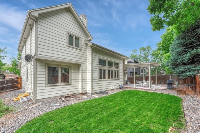 19149 E Ida Dr, Aurora, CO 80015 - back of property with a pergola, a chimney, and a patio area