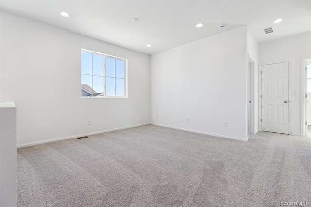 empty room featuring light colored carpet