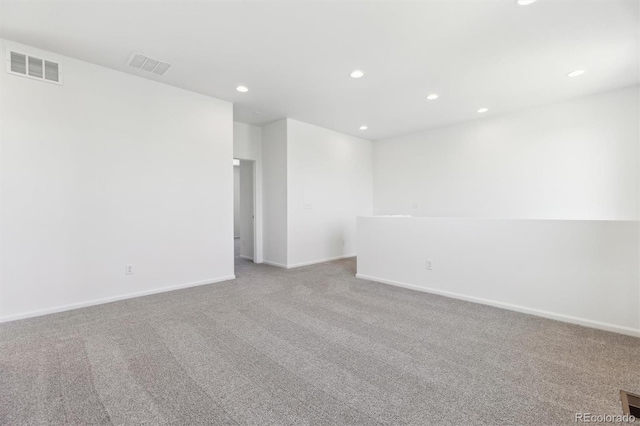 empty room featuring light colored carpet