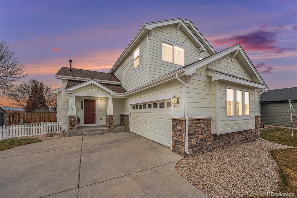 craftsman inspired home with a garage