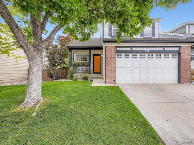 9867 Mulberry Way, Highlands Ranch, CO 80129 - view of front of home with brick siding, driveway, covered porch, and a garage