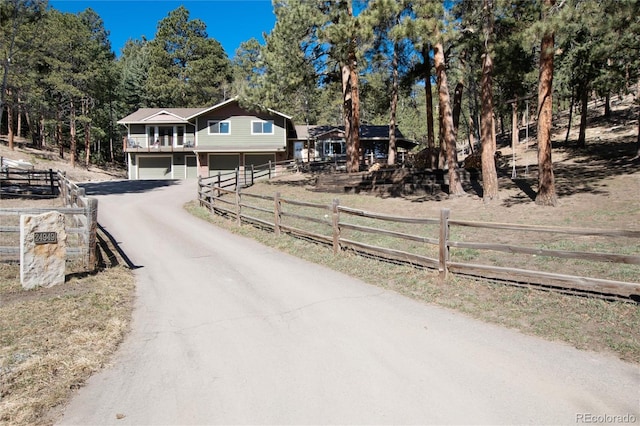 view of street featuring aphalt driveway