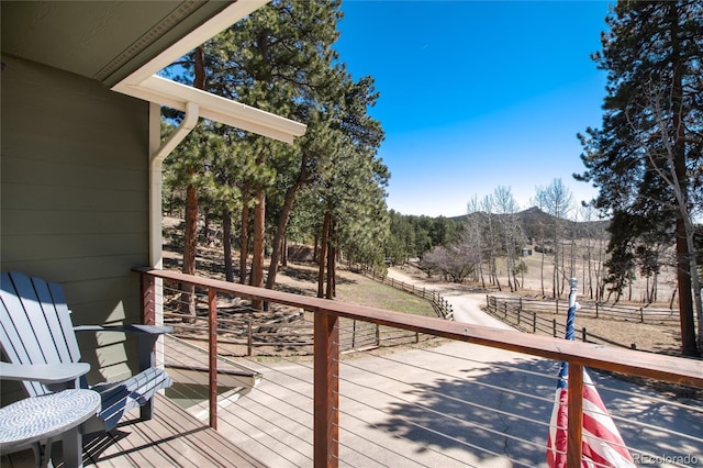 wooden deck with a mountain view