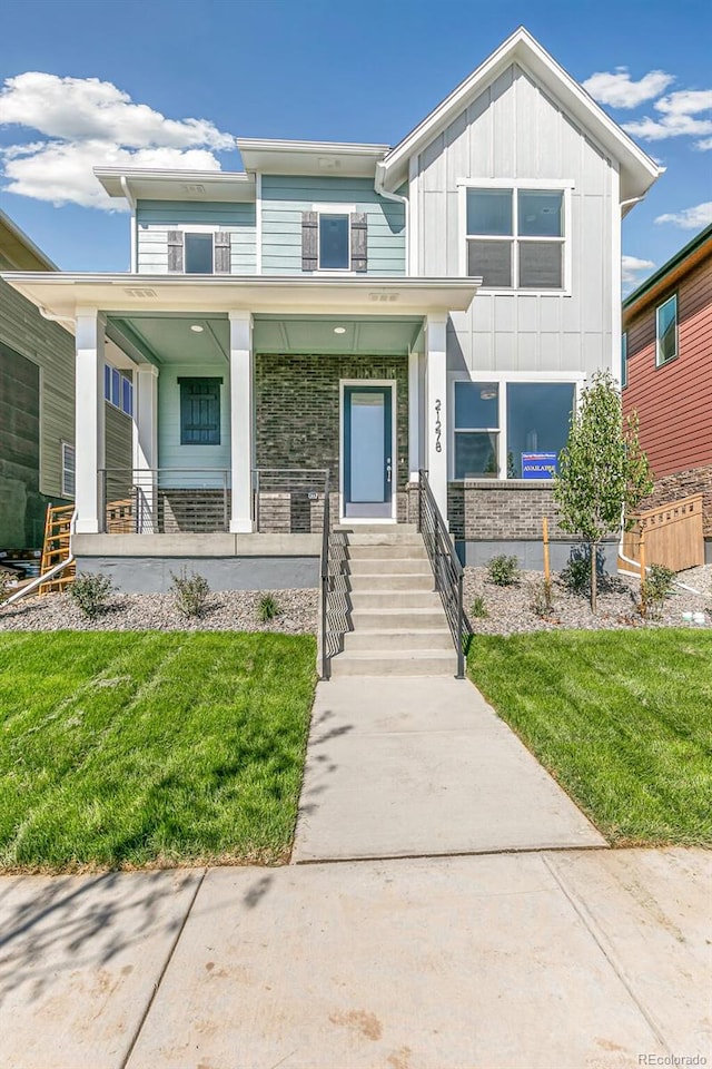 view of front of house featuring a porch and a front lawn