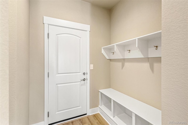 mudroom with light hardwood / wood-style flooring