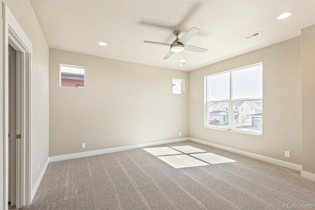 empty room with carpet flooring and ceiling fan