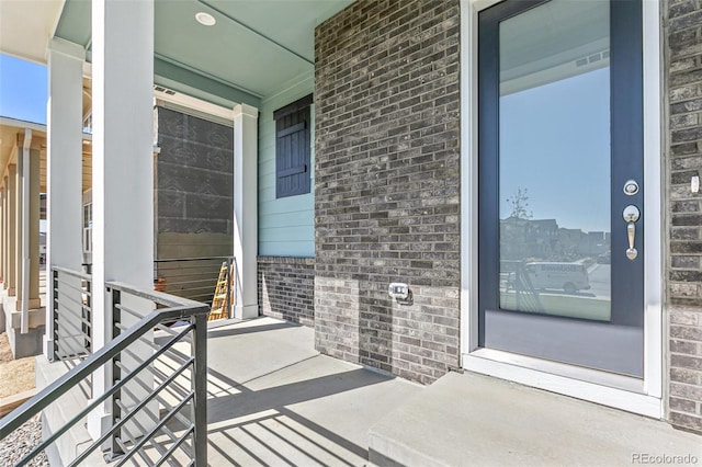 doorway to property featuring a porch