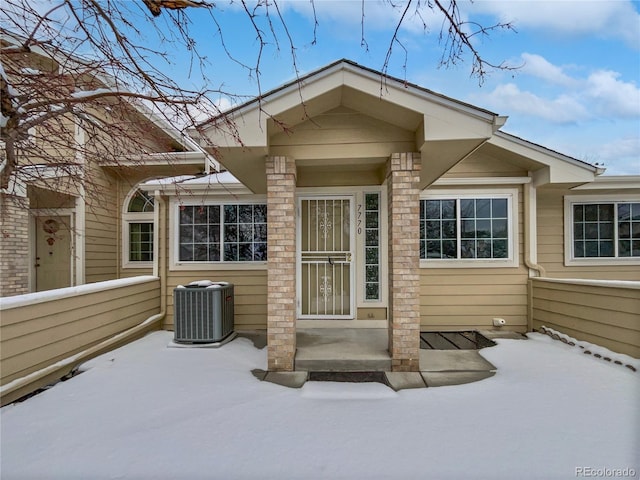 entrance to property featuring central AC