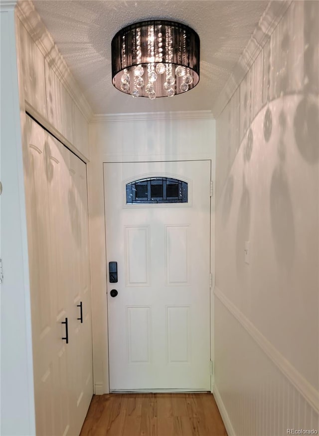 715 S Alton Way Unit 10A, Denver, CO 80247 - entryway featuring light wood finished floors and a textured ceiling