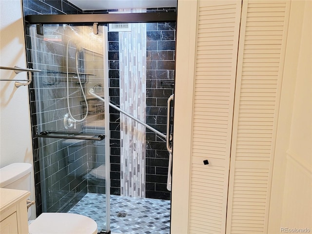 715 S Alton Way Unit 10A, Denver, CO 80247 - full bath featuring toilet, a shower stall, a closet, and vanity