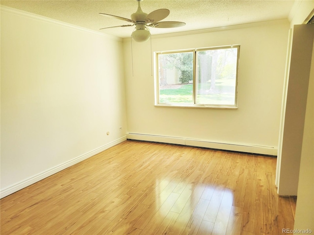 715 S Alton Way Unit 10A, Denver, CO 80247 - empty room featuring baseboard heating, crown molding, ceiling fan, light wood-style floors, and a textured ceiling