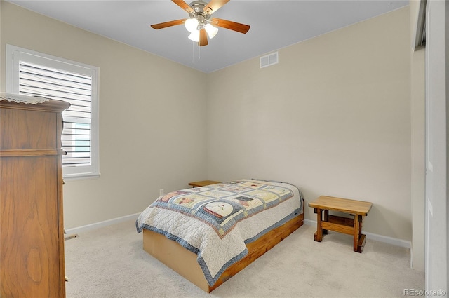 carpeted bedroom featuring ceiling fan