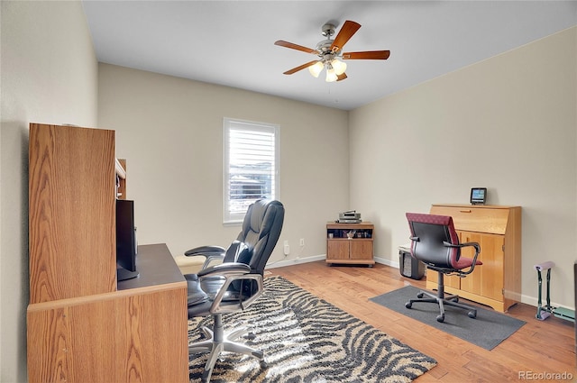 home office with ceiling fan and wood-type flooring