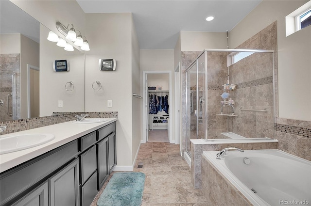 bathroom featuring vanity and separate shower and tub