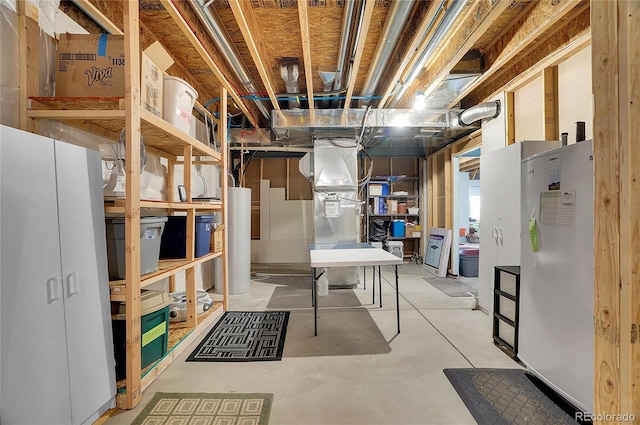 basement with white refrigerator