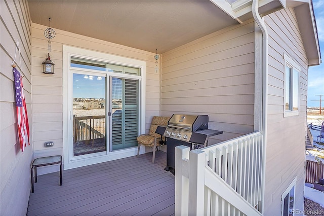 wooden deck featuring area for grilling