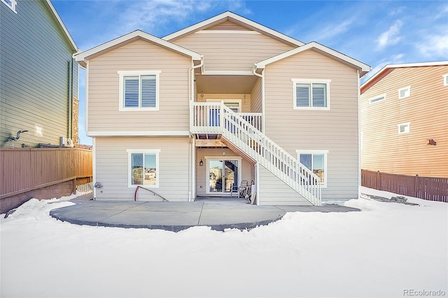 view of snow covered house