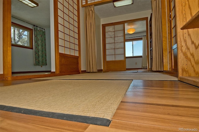 interior space with hardwood / wood-style flooring