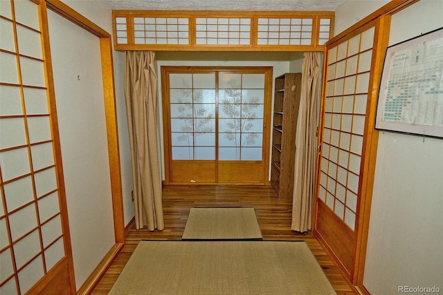 entryway featuring french doors and hardwood / wood-style flooring