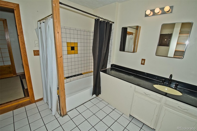 bathroom with shower / bath combo with shower curtain, tile patterned floors, and vanity