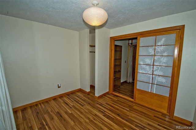 empty room featuring hardwood / wood-style floors