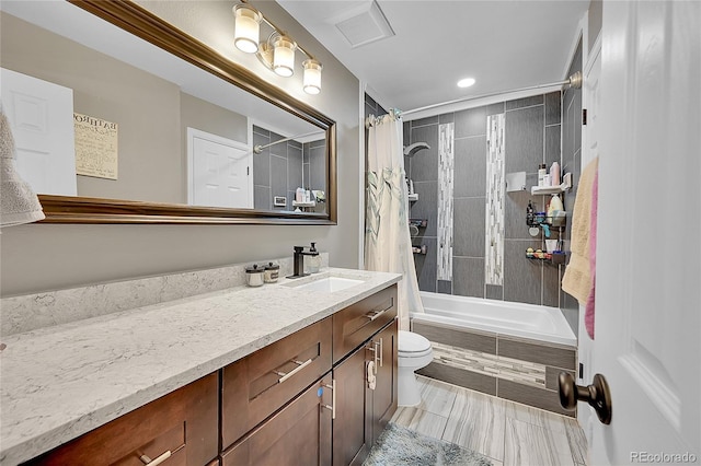 full bathroom with vanity, toilet, and shower / bath combo with shower curtain