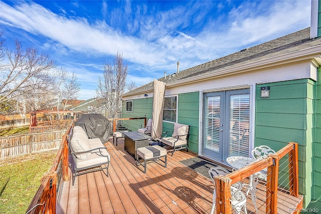 wooden terrace with french doors and grilling area