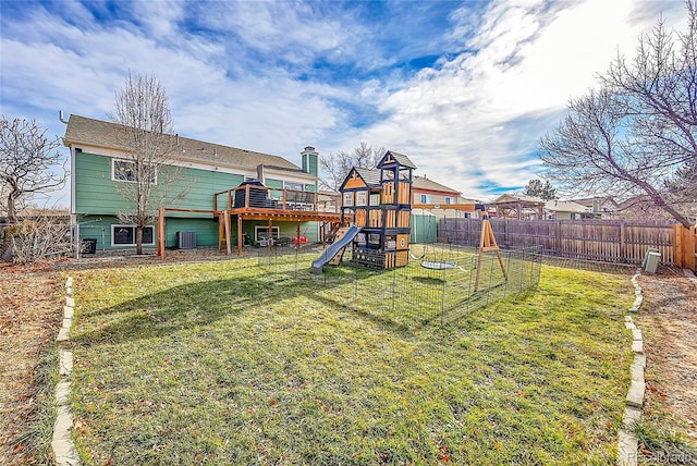 view of yard featuring a playground and central AC unit