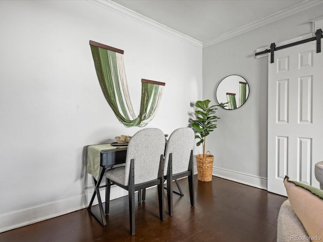 dining area featuring dark wood-type flooring, crown molding, and a barn door