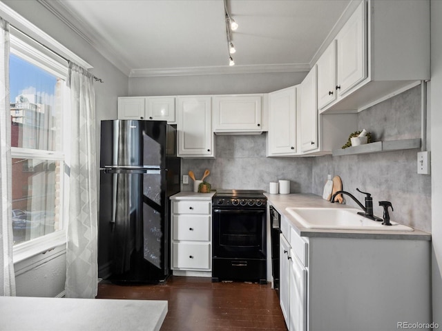 kitchen with black appliances, dark wood-type flooring, crown molding, white cabinets, and sink