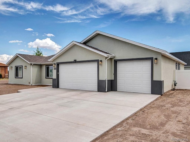 single story home with a garage