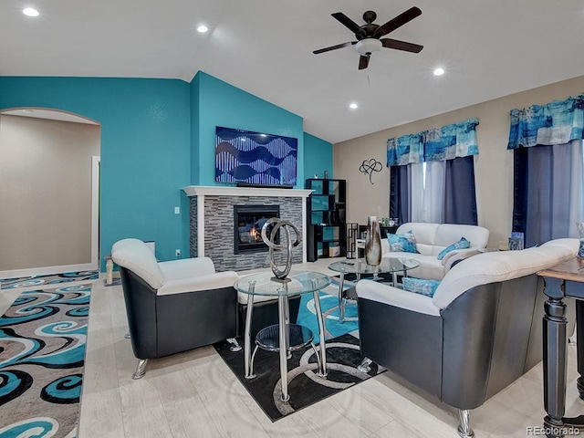 living room with lofted ceiling and ceiling fan