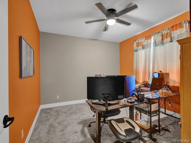 office area featuring ceiling fan and carpet floors