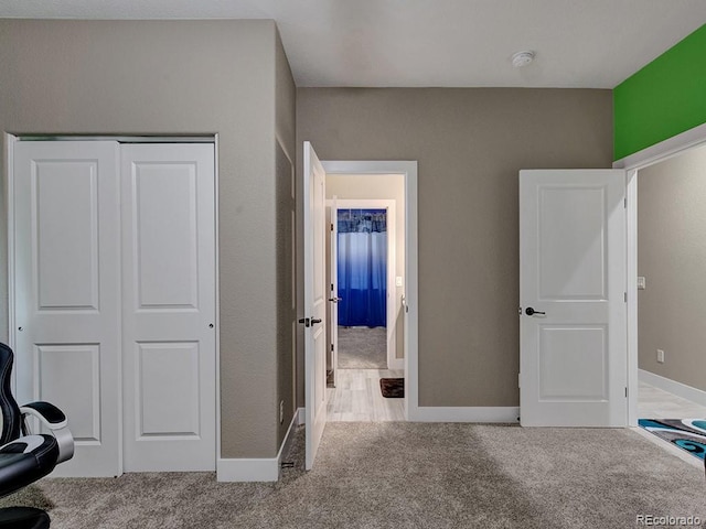 carpeted bedroom featuring a closet