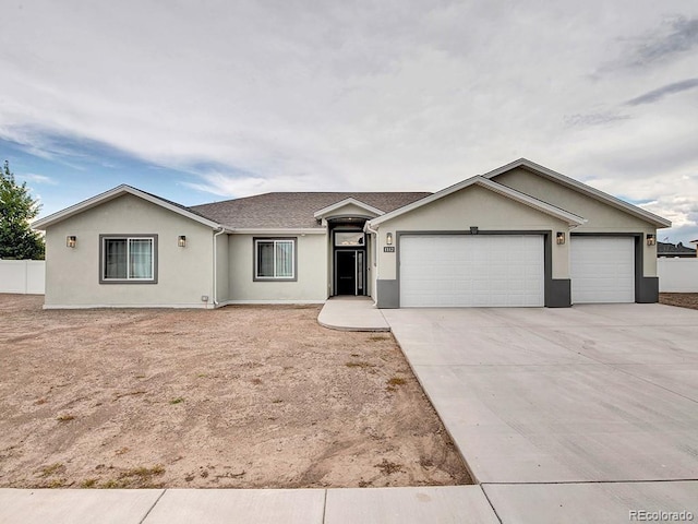 ranch-style house featuring a garage