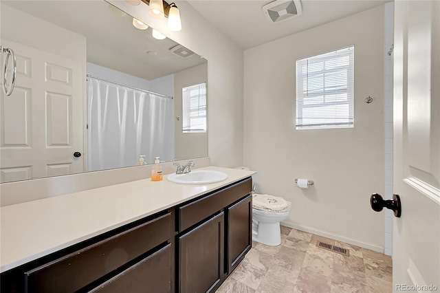 bathroom with toilet and vanity