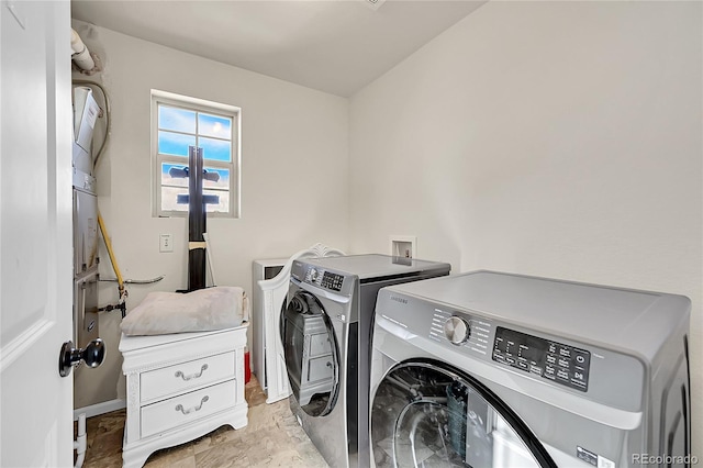 laundry room featuring separate washer and dryer