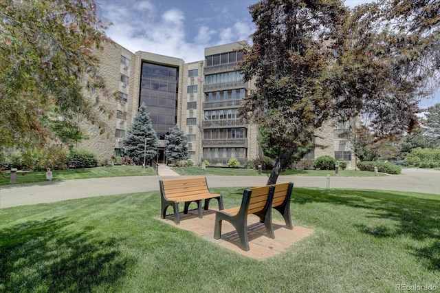 view of home's community featuring a lawn