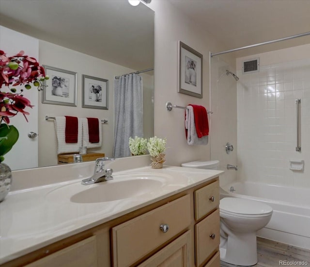 full bathroom featuring toilet, vanity, shower / bath combo, and hardwood / wood-style floors