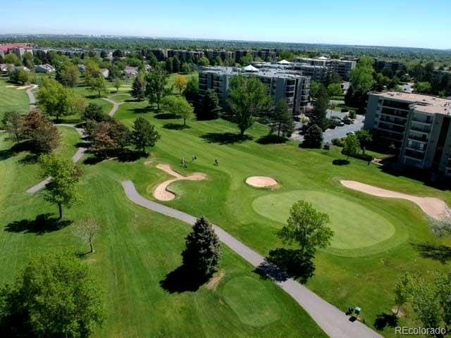 birds eye view of property with golf course view