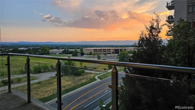 view of balcony at dusk