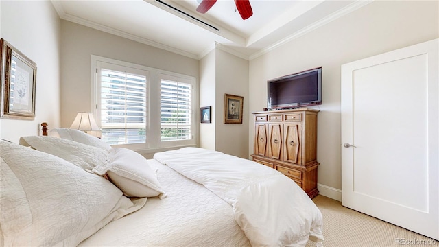 bedroom featuring ceiling fan, crown molding, baseboards, and light carpet