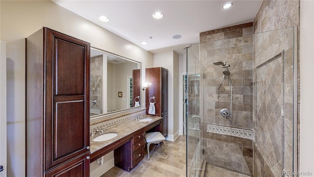 bathroom featuring recessed lighting, vanity, and a shower stall