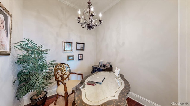 office space with crown molding, a notable chandelier, wood finished floors, and baseboards