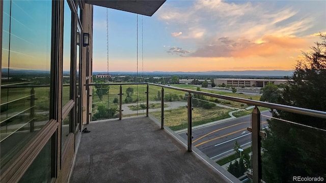 view of balcony at dusk