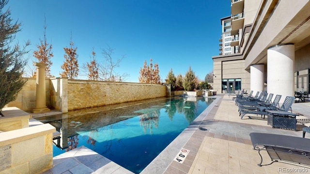 pool with a patio