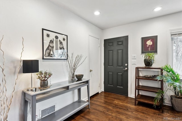 entryway with recessed lighting, visible vents, and wood finished floors