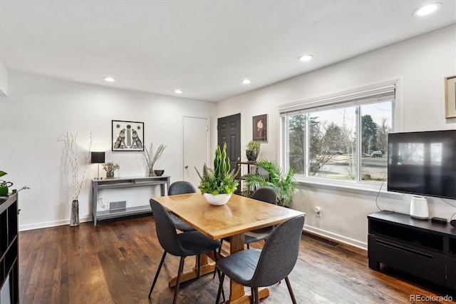 dining space with recessed lighting, wood finished floors, and baseboards