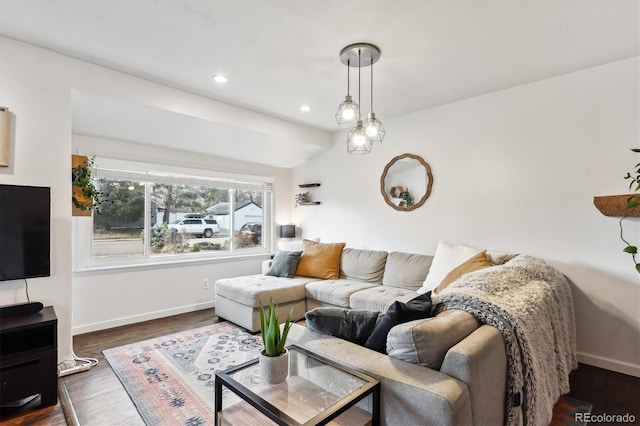 living room featuring recessed lighting, baseboards, and wood finished floors